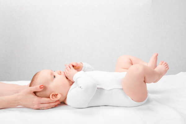 Six,Month,Baby,Girl,Receiving,Osteopathic,Or,Chiropractic,Treatment,In
